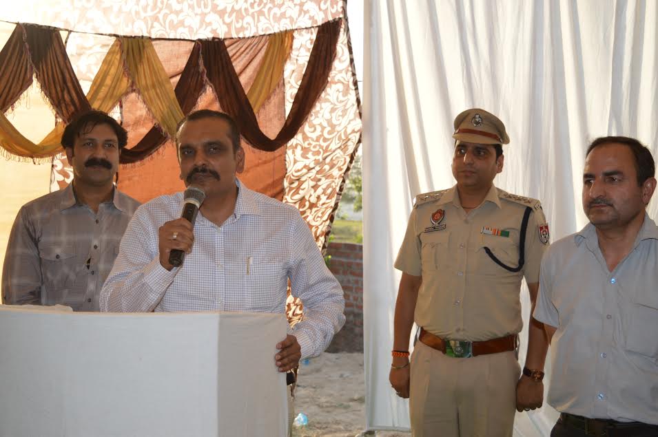 Addressing a police public meeting in a Pathankot village